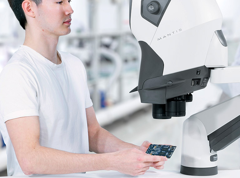 Mantis Elite Cam microscope used by man for cable connector inspection