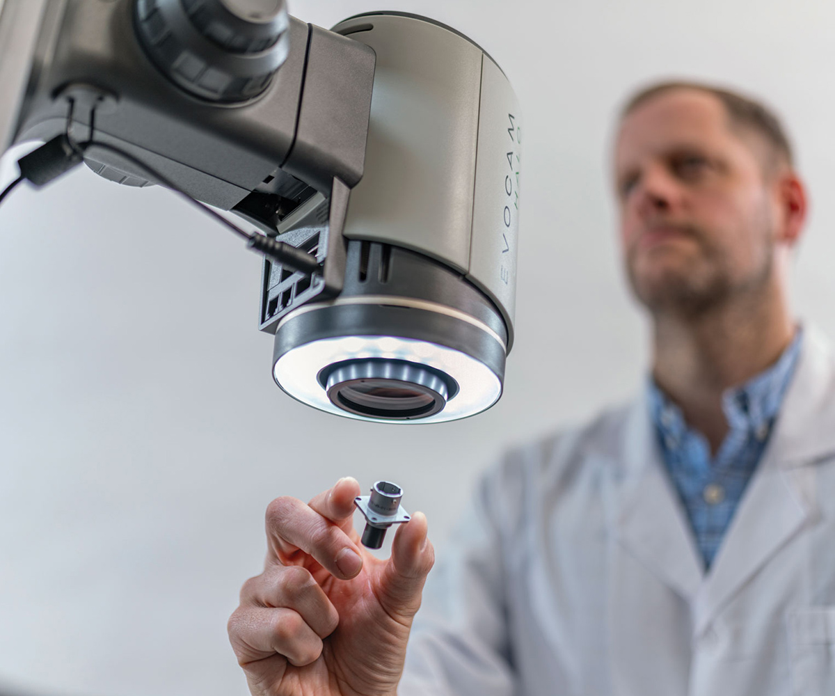 EVO Cam HALO illumination 1200×1000 Man inspecting a metal component with HALO digital microscope